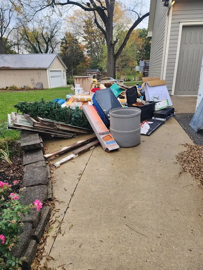 Dumpster being loaded with debris for Demolition Dumpster Rental in Karnes City
